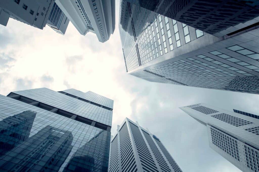 Tall modern government buildings in California viewed from below, symbolizing ADA compliance and accessibility planning