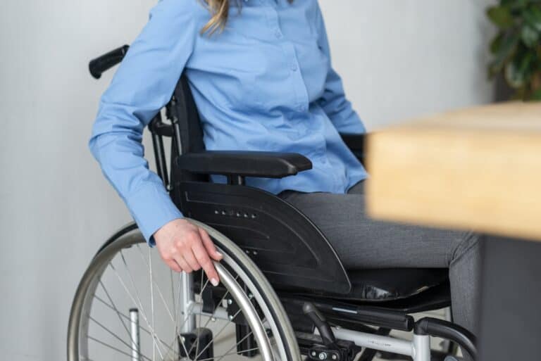 close up woman wheelchair office 1