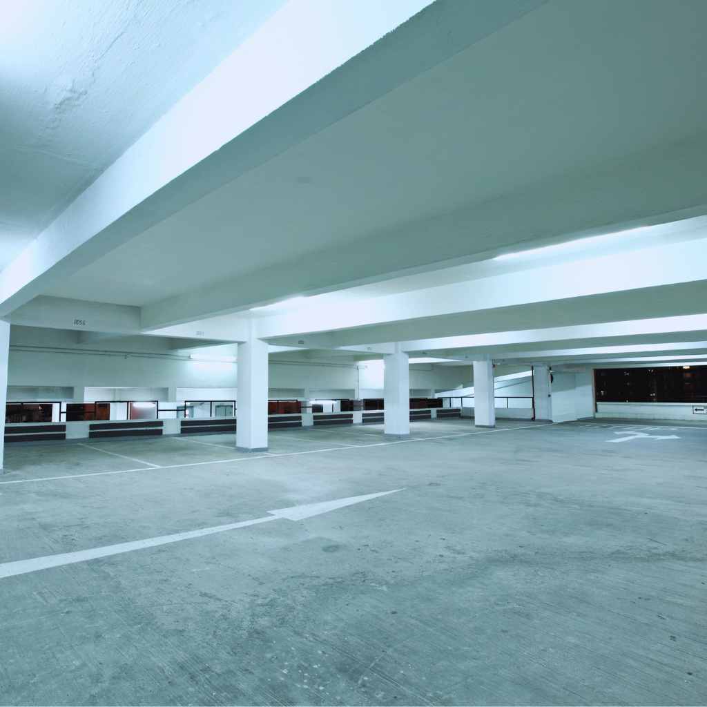 ADA Lawsuit in Fresno? Here’s How Local Businesses Can Bounce Back 4 Spacious indoor parking garage with level surfaces and marked stalls, representing accessible parking features businesses in Fresno must address post-ADA lawsuit
