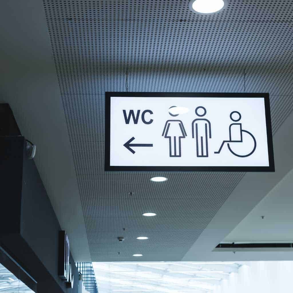 Accessible Restroom Direction Sign in a Public Building